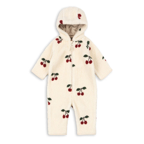 White baby snowsuit with cherry pattern on a white background