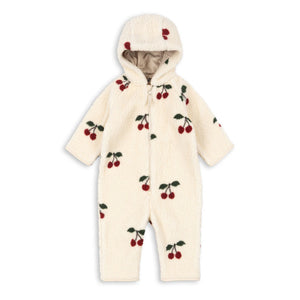 White baby snowsuit with cherry pattern on a white background