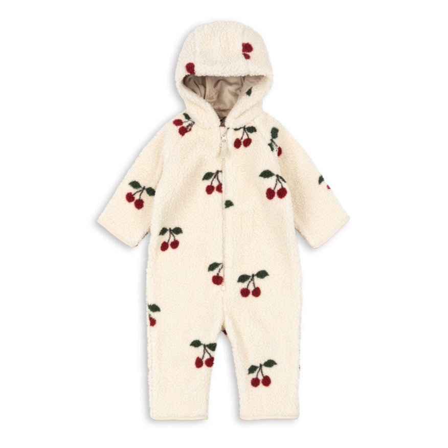 White baby snowsuit with cherry pattern on a white background