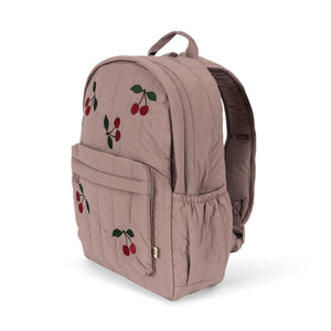 Pink backpack with cherry designs on a white background