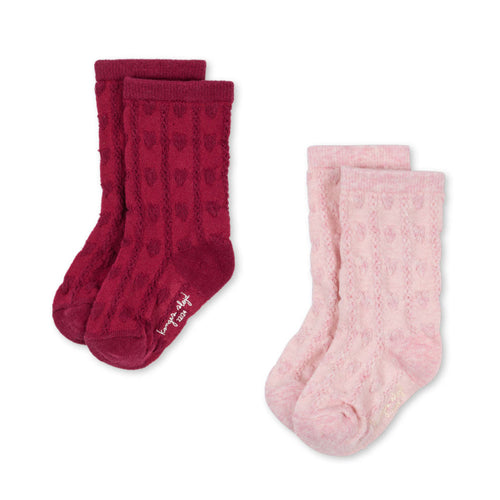 Two pairs of socks, one red and one pink, on a white background.