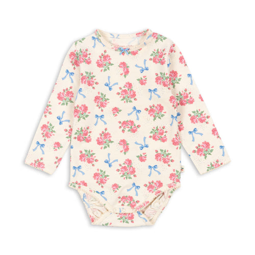 Floral patterned baby bodysuit on a white background