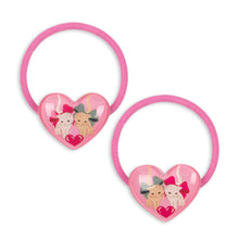Load image into Gallery viewer, Two pink hair ties with heart designs and cartoon characters on a white background