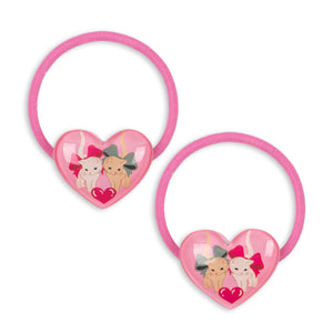 Two pink hair ties with heart designs and cartoon characters on a white background