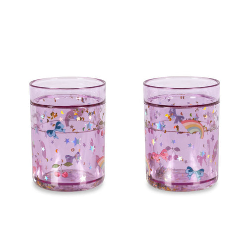 Two pink glasses with unicorn designs on a white background