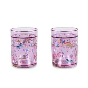 Two pink glasses with unicorn designs on a white background