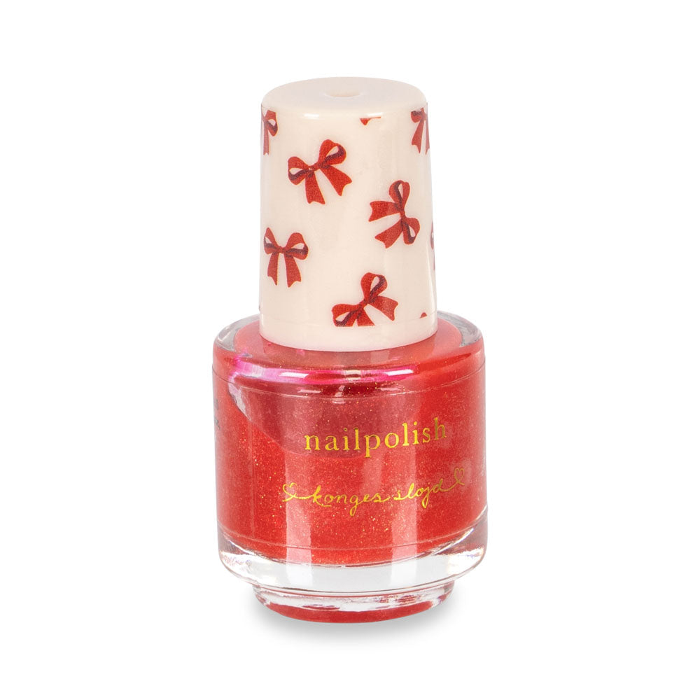 Red nail polish bottle with a white cap featuring red bows on a white background