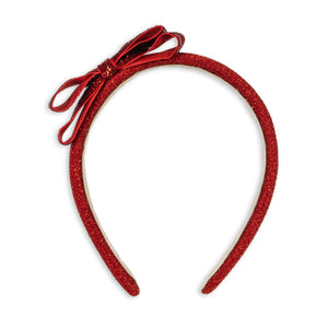Red headband with a bow on a white background