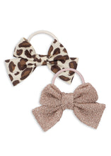 Load image into Gallery viewer, Two hair bows with leopard print and glitter on white background