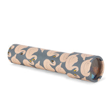 Load image into Gallery viewer, A rolled-up cylindrical item, likely a towel or blanket, featuring an all-over pattern of stylized swans in beige and brown tones on a slate gray background.