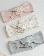 Load image into Gallery viewer, Quincy Mae knotted headband with flower field print, featuring soft fabric and a stylish, comfortable design for babies and toddlers.