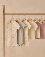 Load image into Gallery viewer, Quincy Mae zip short sleeve sleeper sleepsuit featuring a cute dinosaur print for infants, soft and comfortable for bedtime.
