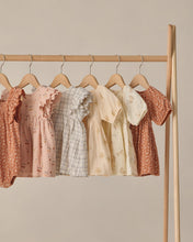 Load image into Gallery viewer, Quincy Mae Alina Dress in cherries, a charming children's dress with cherry print, displayed hanging on a rack.