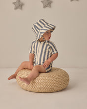 將圖片載入圖庫檢視器 Baby girl wearing Quincy Mae Zip Rashguard One-Piece Retro Ocean Stripe swimwear with colorful horizontal stripes and long sleeves.