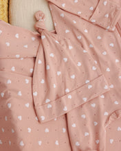 Load image into Gallery viewer, Pink bamboo swaddle blanket with heart pattern and matching knotted hat from Quincy Mae, soft and cozy for babies.