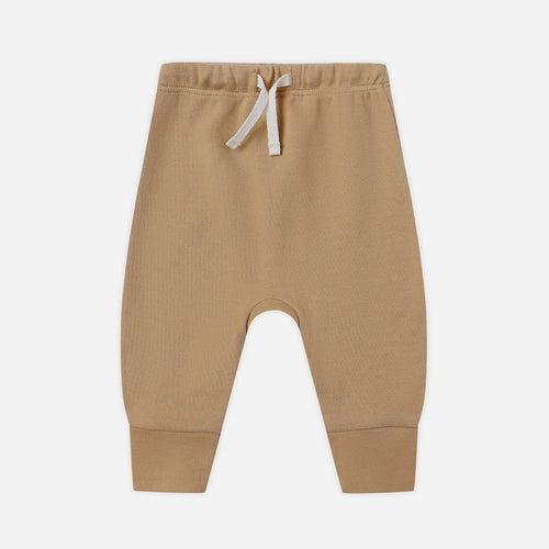Beige baby pants with a drawstring on a white background