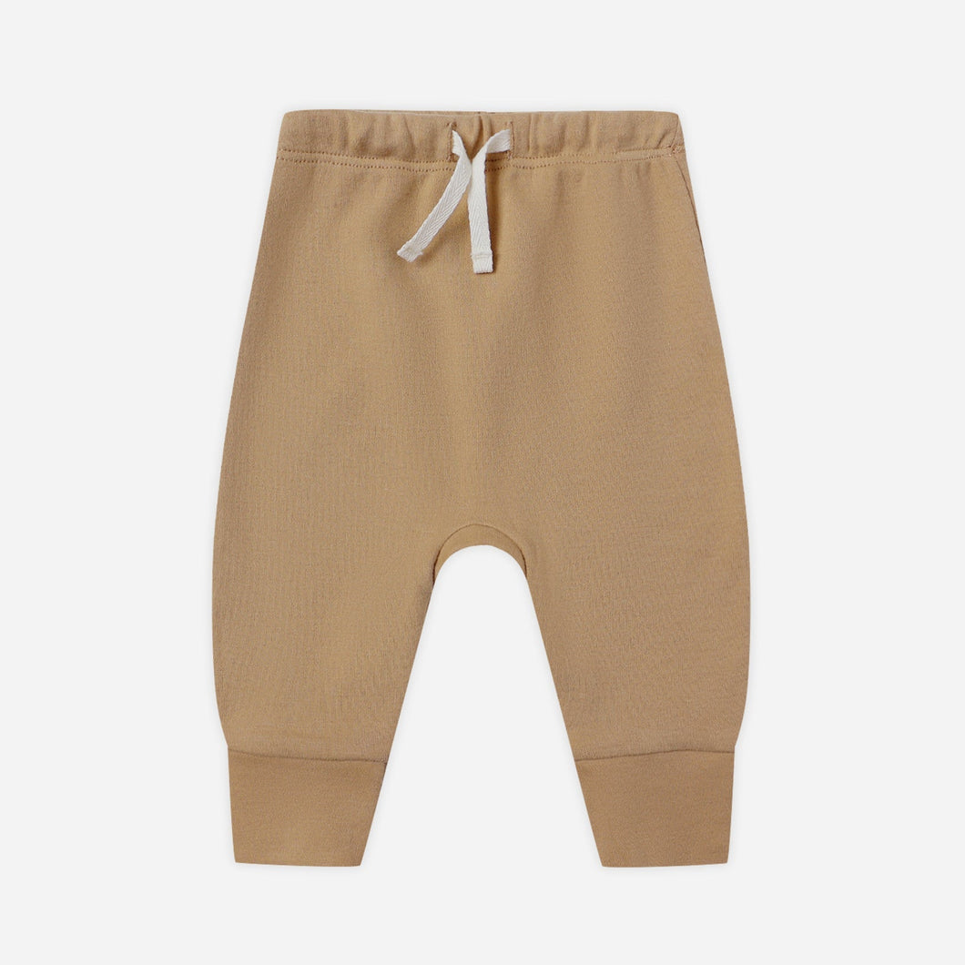 Beige baby pants with a drawstring on a white background