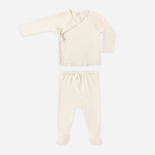 Baby outfit with top and pants on a white background