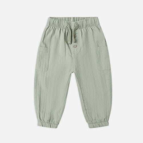 Green baby pants on a white background