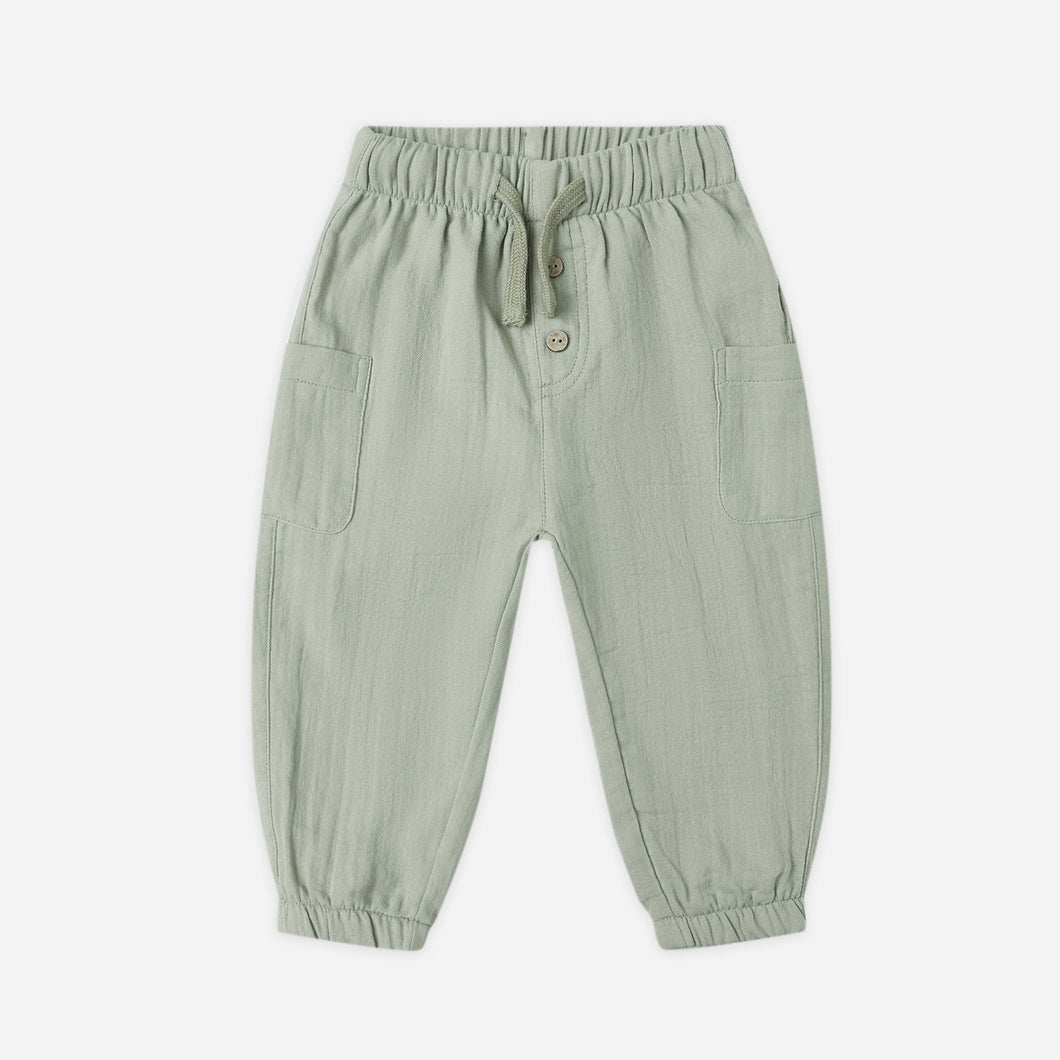 Green baby pants on a white background