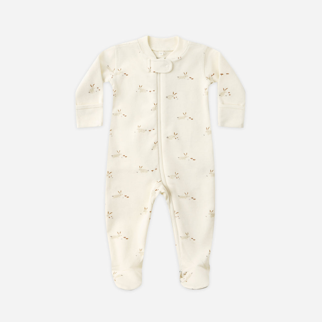 Baby onesie with subtle pattern on a white background