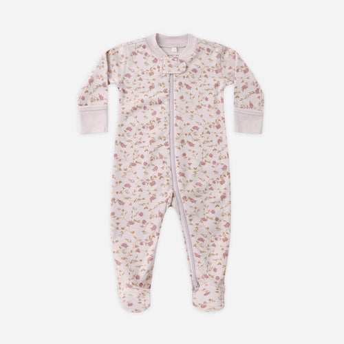 Floral patterned baby onesie on a white background