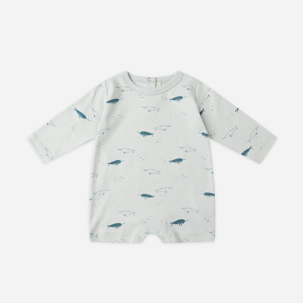 Baby romper with whale pattern on a white background
