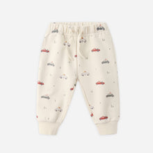 Load image into Gallery viewer, Beige baby pants with car pattern on a white background