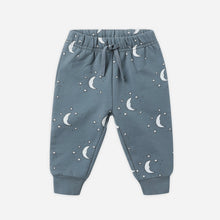 Load image into Gallery viewer, Blue children&#39;s pants with moon pattern on a white background