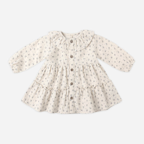 Floral patterned baby dress on a white background