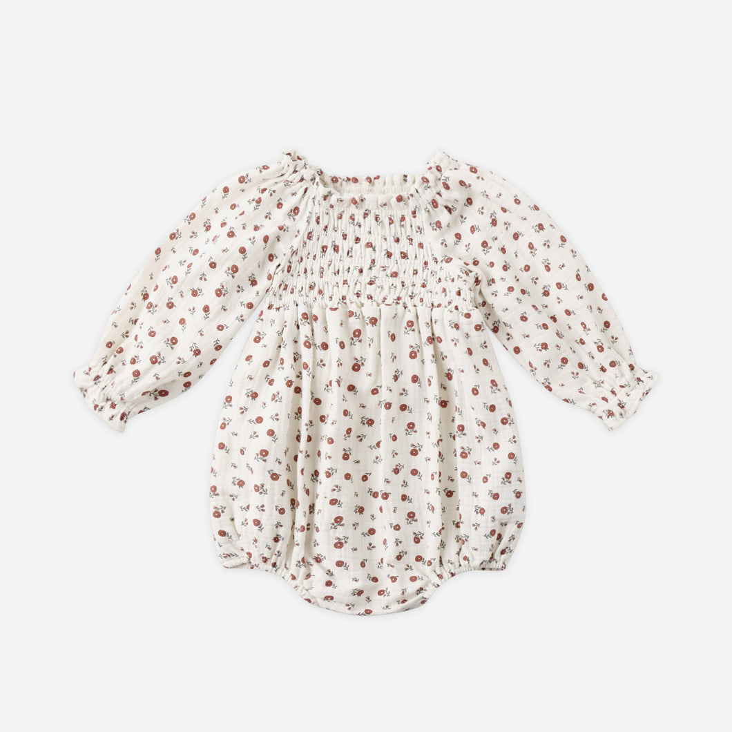 Baby romper with floral pattern on a white background