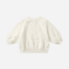 Load image into Gallery viewer, White baby sweater with small patterns on a light gray background