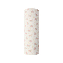 Load image into Gallery viewer, Roll of white fabric with pink floral pattern on a white background