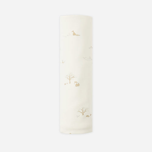 White candle with floral design on a white background
