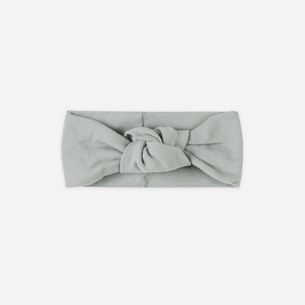 Gray headband with a knot on a white background
