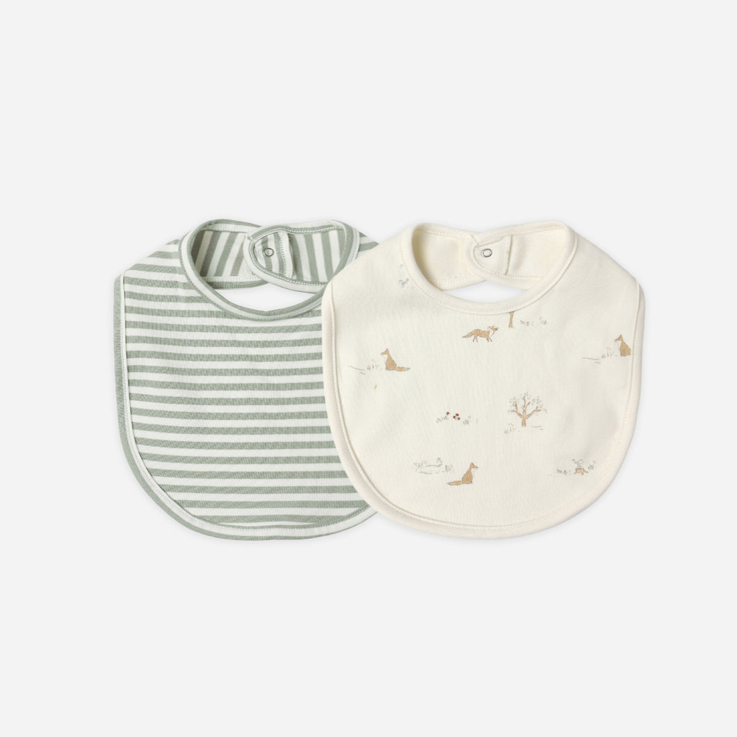 Two baby bibs, one striped and one with a nature print, on a white background