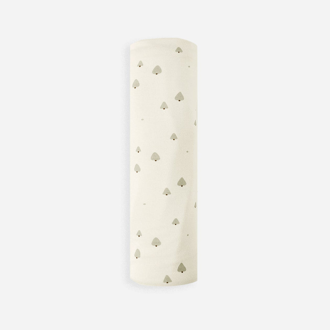 White cylindrical object with small holes on a light beige background