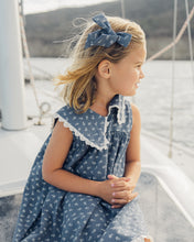 Load image into Gallery viewer, Rylee+Cru Bow Ditsy headband with a floral print, featuring a soft fabric and a stylish bow design on a light-colored background.