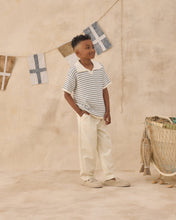 Load image into Gallery viewer, Rylee+Cru Chandler Knit Polo top in marine stripe with a classic collar and short sleeves, displayed on a plain background.
