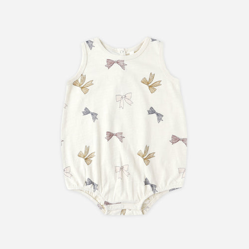 Baby romper with bow pattern on a white background