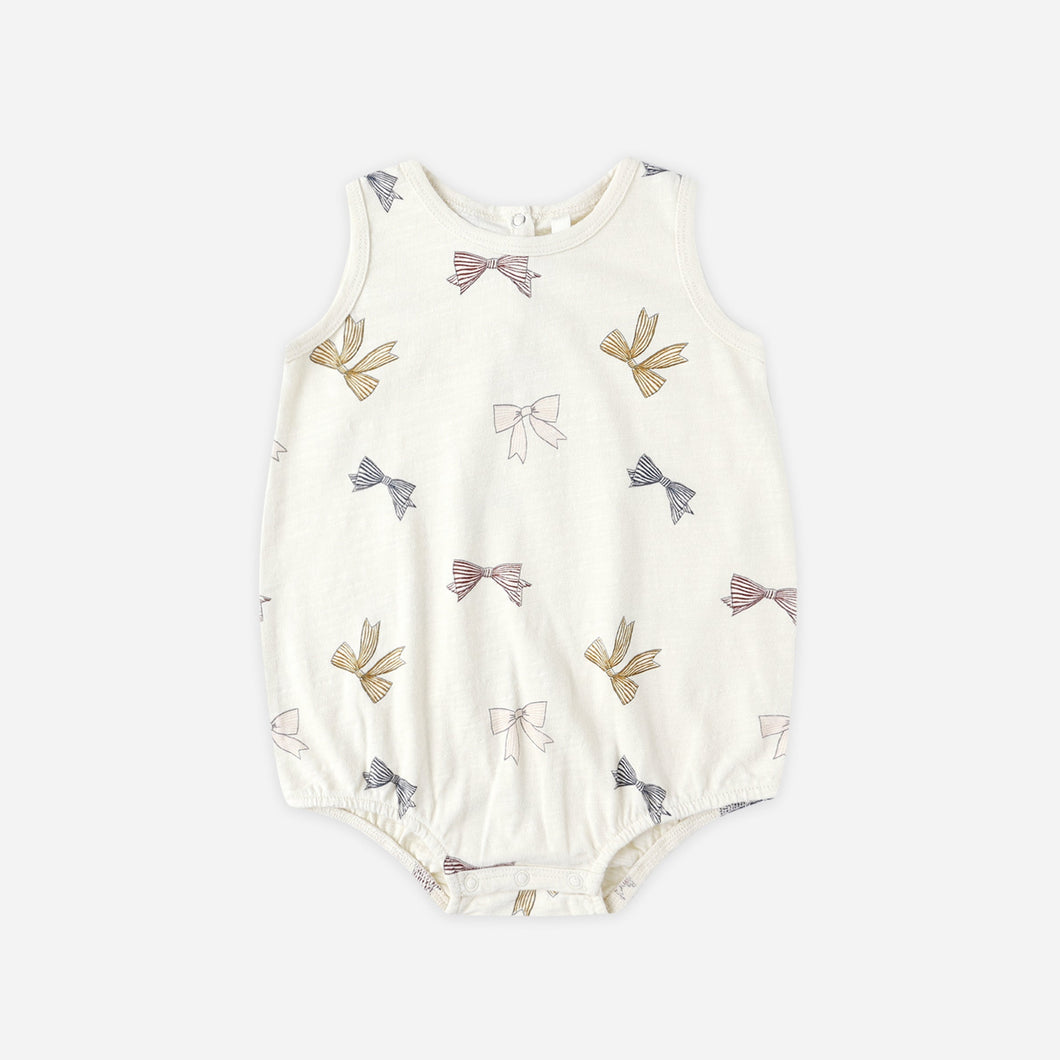 Baby romper with bow pattern on a white background