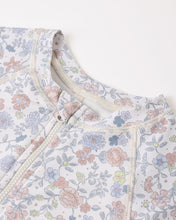 Load image into Gallery viewer, Baby girl Rylee+Cru one-piece rashguard swimwear in ivory with floral bloom pattern, designed for toddlers' swimming and sun protection.