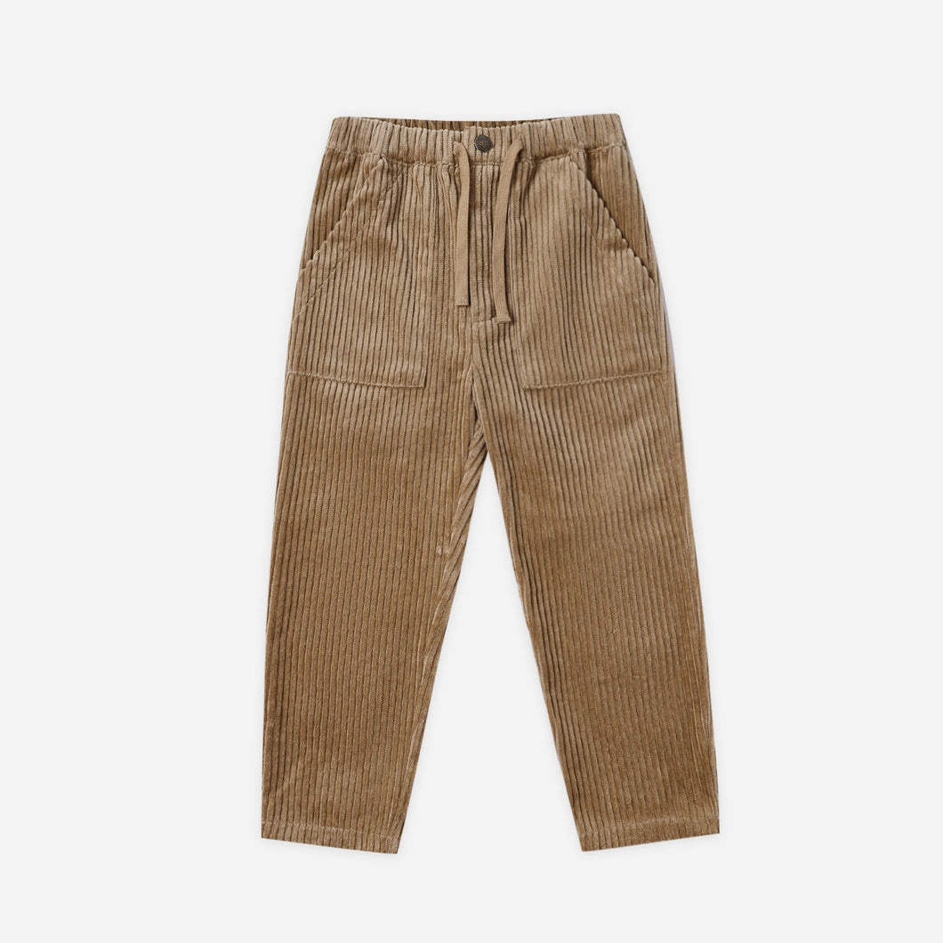 Brown corduroy pants on a white background