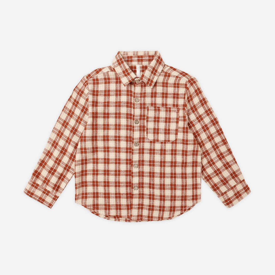 Red and white checkered shirt on a light beige background