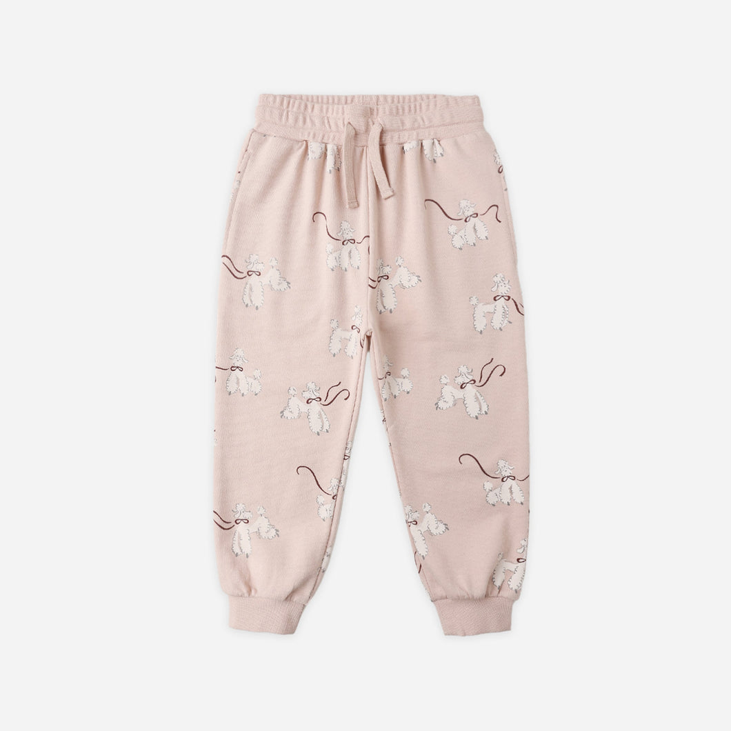 Pink sweatpants with a subtle pattern on a white background