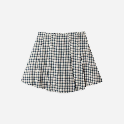 Black and white checkered skirt on a light gray background