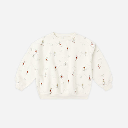 White textured sweater on a light beige background