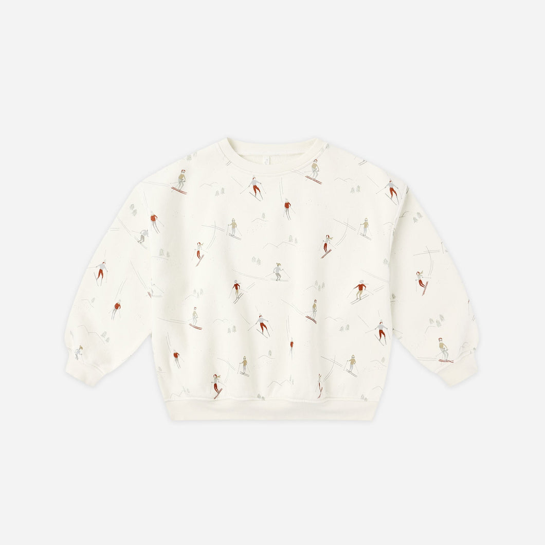 White textured sweater on a light beige background