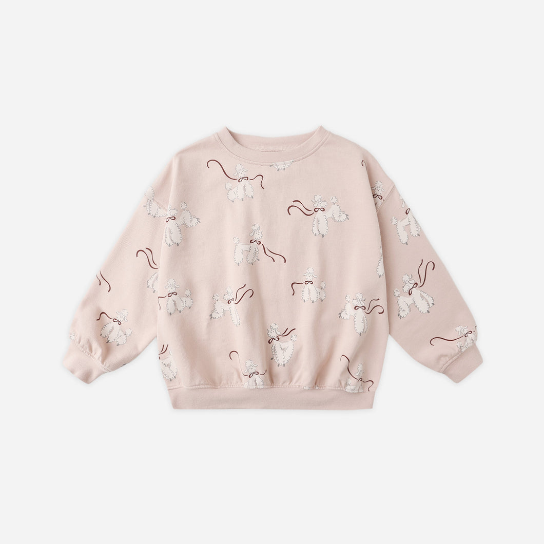 Pink sweatshirt with floral patterns on a white background