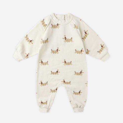 Baby onesie with dog pattern on a white background
